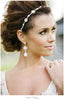 bride with pearl drop earrings and headpiece